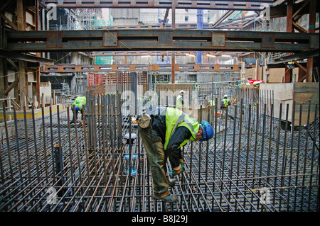 Steel fixer preparing steelwork prior to concrete pour. This Stock ...