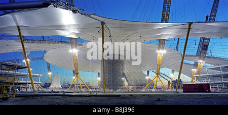 Attaching the PFTE-coated fabric roof to the cable net structure during building of the Millennium Dome/O2 Arena in London, UK. Stock Photo