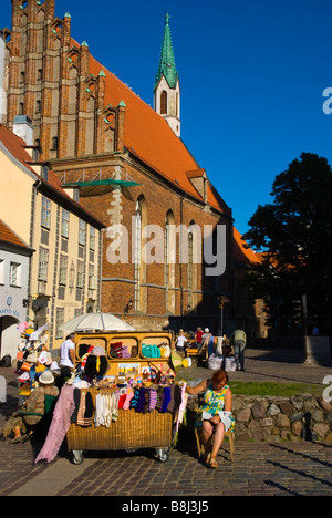 Market stalls selling souvenirs and handicrafts at St Peters church in old town Riga Latvia Europe Stock Photo