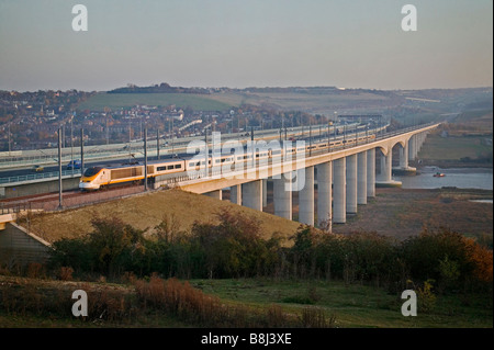 Eurostar high-speed train crosses the Medway Viaduct in autumn sunshine en route to St Pancras on the Channel Tunnel Rail Link. Stock Photo