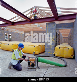 Inflatable modular air mat system mitigates fatal or serious injuries caused to construction workers by falling from height. Stock Photo