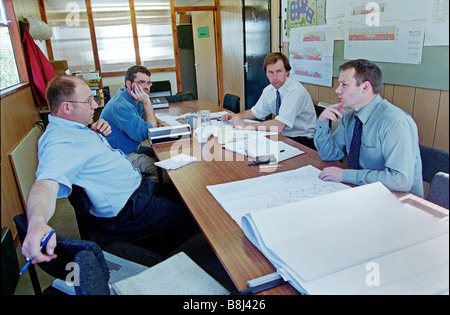 Working with clients, engineers and architects, managers ensure construction projects are delivered on-time and within budget. Stock Photo