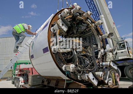 Contractors prepare tunnel boring machine to be lowered underground to excavate a power cable tunnel in London. Stock Photo