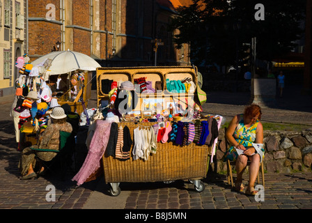 Market stalls selling souvenirs and handicrafts at St Peters church in old town Riga Latvia Europe Stock Photo