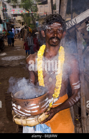 India Tamil Nadu Kumbakonam Hinduism Thaipusam festival devotee carrying smoking ceramic pot Stock Photo