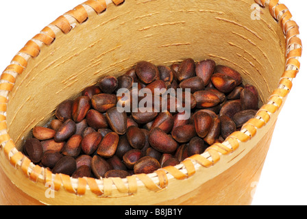 Close-up a pile of cedar nut on basket Stock Photo