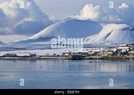 dh Harbour STROMNESS ORKNEY Fishingboat leaving harbour winter snow white hills landscape scenery Stock Photo