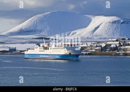 dh Northlink ferries boat STROMNESS HARBOUR ORKNEY MV Hamnavoe roro ferry snow hills snowscape winter scene Stock Photo