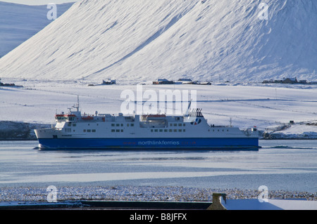 dh MV Hamnavoe STROMNESS ORKNEY Northlink ferries ferry entering Scapa Flow wintertime snowscape landscape Stock Photo