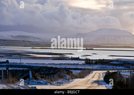 dh  HARRAY ORKNEY Loch Harray Stenness Hoy Hills snowy icy roads lanes wintertime landscape countryside uk winter open road scotland country
