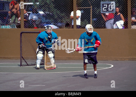 Native American Indians playing a Game of Lacrosse and Goalie defending Net Stock Photo