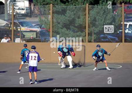 Native American Indians playing a Game of Lacrosse and Goalie defending Net Stock Photo