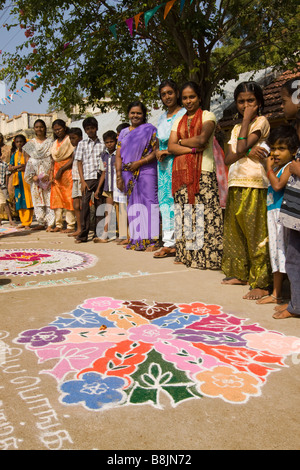 India Tamil Nadu Madurai Thiruchuli Village Pongal celebration Rangoli competitors with their designs Stock Photo