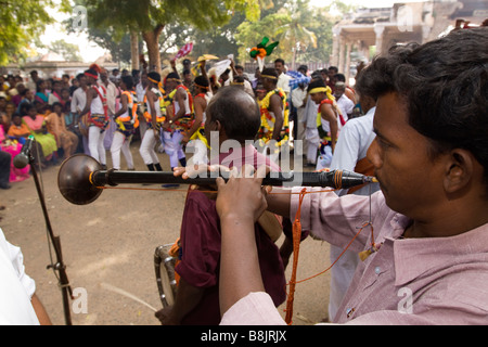 India Tamil Nadu Madurai Thiruchuli village Pongal harvest festival musician playing Nadaswaram trumpet accompanying dancers Stock Photo