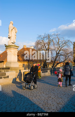 People on Charles Bridge in winter in Prague Czech Republic Europe Stock Photo