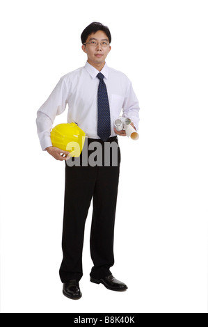 Young engineer holding rolls of blueprint and a helmet Stock Photo