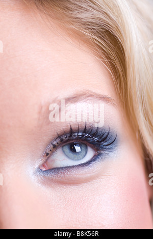 Close up of a beautiful young blond woman looking up