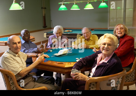 Senior adults playing bridge Stock Photo