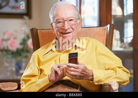 Senior man text messaging Stock Photo