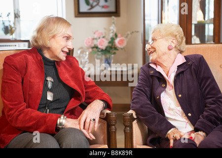 Senior women relaxing in armchairs Stock Photo