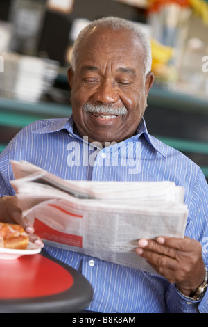 Senior man having morning tea Stock Photo
