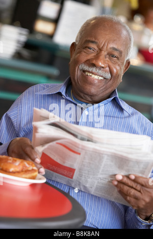 Senior man having morning tea Stock Photo
