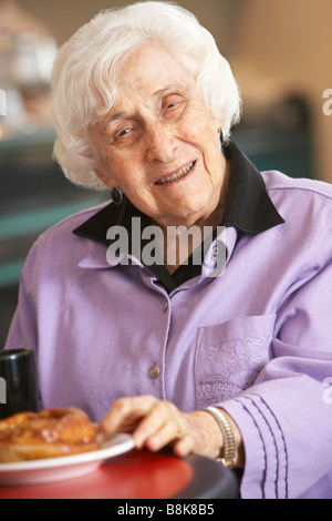 Senior woman having morning tea Stock Photo