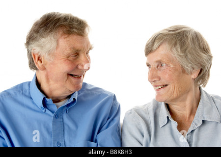 Portrait of senior couple smiling at each other Stock Photo