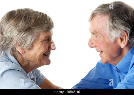 Portrait of senior couple smiling at each other Stock Photo
