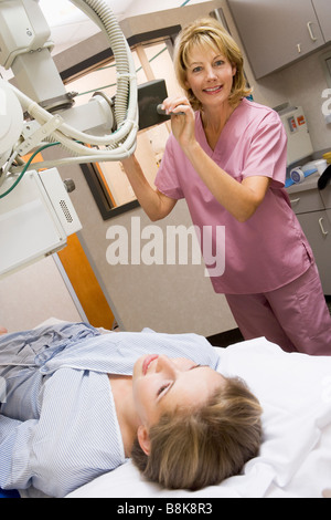 Nurse With Patient Having An X-Ray Stock Photo