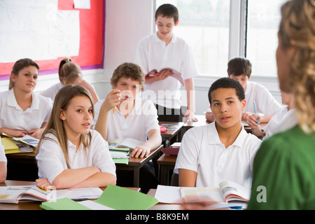 Secondary school student reading out loud in classroom Stock Photo