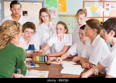 Students receiving chemistry lesson in classroom Stock Photo