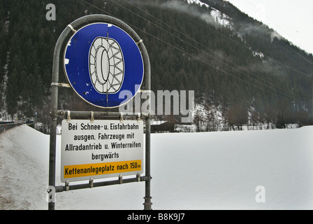 traffic sign on winter road Mayrhofen Austria Stock Photo