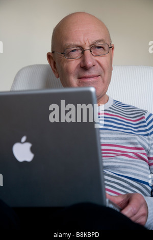 Older man with laptop Stock Photo