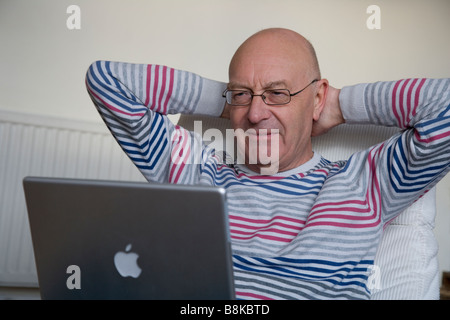 Older man with laptop Stock Photo