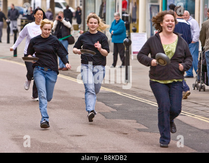 Competitors take part in annual pancake races held in Chippenham uk. Stock Photo