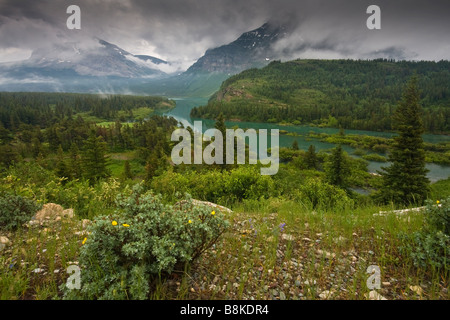 Overlooking where Swiftcurrent lake flows into Sherburne Lake in Glacier National Park Stock Photo