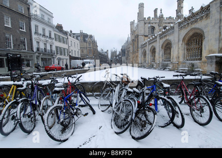 Bicycles outside of Kings College in Cambridge after a winter snowfall Stock Photo