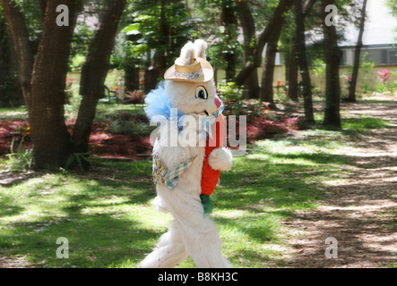 A photo of the Easter Bunny running by on his way to hide eggs Photo taken while panning to enhance action Stock Photo