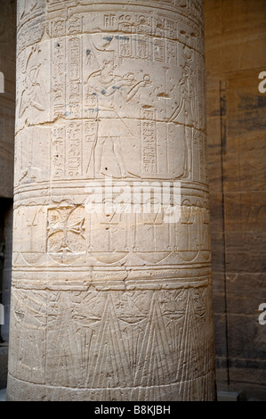 Coptic cross on column, Pharaoh offering gifts to Isis, Inside the Temple of Isis, New Philae island, Aswan, Egypt 081121 33300 Stock Photo