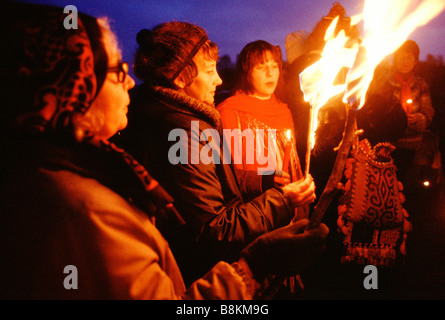 Greenham Berkshire UK 13 December 1982 Protesters at the Greenham Common Women's Peace Camp hold a candle-lit vigil. Stock Photo