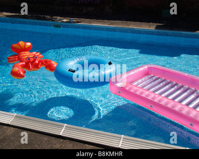 Inflatable objects in a swimming pool. Stock Photo