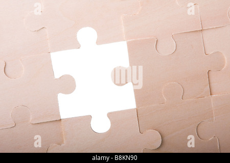 the detail of a missing piece in a puzzle Stock Photo