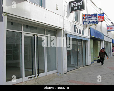 Empty closed down shop units in a desolate part of Worthing shopping centre due to the credit crunch Stock Photo