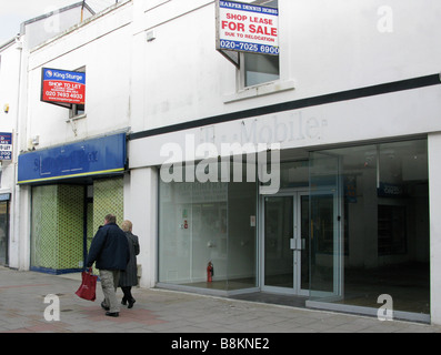 Empty closed down shop units in a desolate part of Worthing shopping centre due to the credit crunch Stock Photo