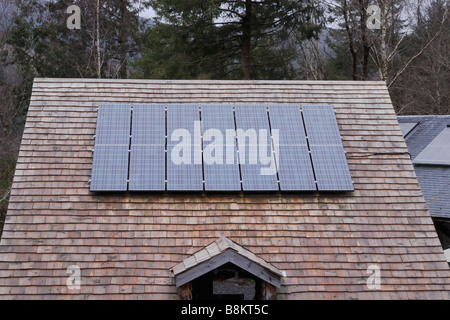 Solar panel on a wooden shingle roof at the Centre for Alternative Technology Machynlleth Wales Stock Photo