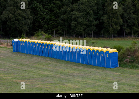 or port-a-loo or mobile Toilet Cubicles in a row Stock Photo