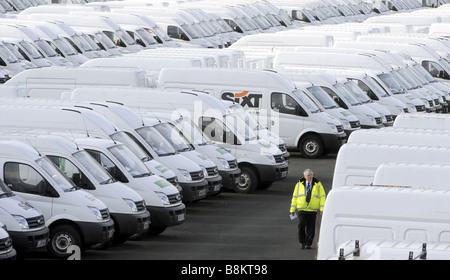 A WORKER WALKS AMONG LINES OF VANS AT THE LDV VAN FACTORY IN DREWS LANE,WASHWOOD HEATH,BIRMINGHAM,ENGLAND,UK Stock Photo