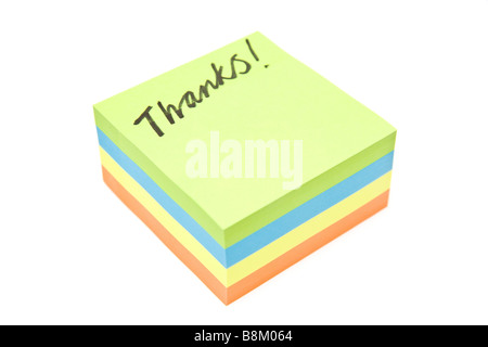Thanks written on a post it notes isolated on a white studio background Stock Photo