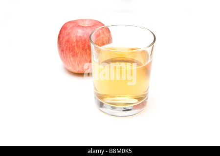 Glass of apple juice with a fuji apple isolated on a white studio background Stock Photo